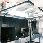 Technician working on a Robot-Assisted Dip Coating System