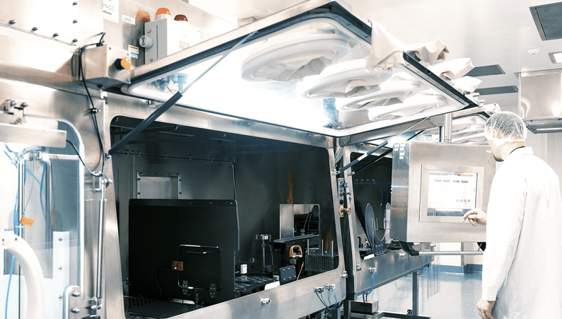 Technician working on a Robot-Assisted Dip Coating System