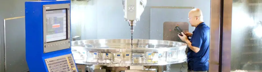 Man working with medical precision fabrication machine