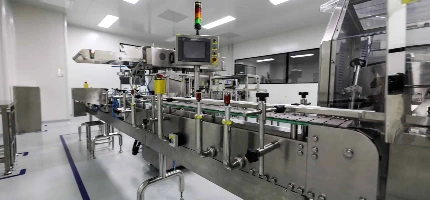 Industrial packaging conveyor belt inside a sterile factory setting.