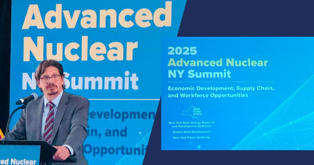 Speaker presenting at the Advanced Nuclear NY Summit in front of conference signage