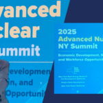 Speaker presenting at the Advanced Nuclear NY Summit in front of conference signage