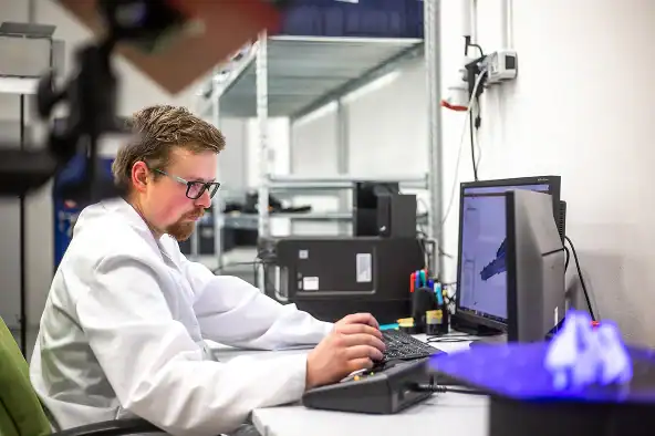 Engineer reviewing a digital prototype model during product development.